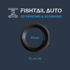 A circular black and dark gray ring-like product centered on a dark blue background, with the text 'FISHTAIL AUTO 3D PRINTING & SCANNING' at the top and '@ft_auto_3dp' near the bottom. The ring has the words 'OG Smooth' printed inside.