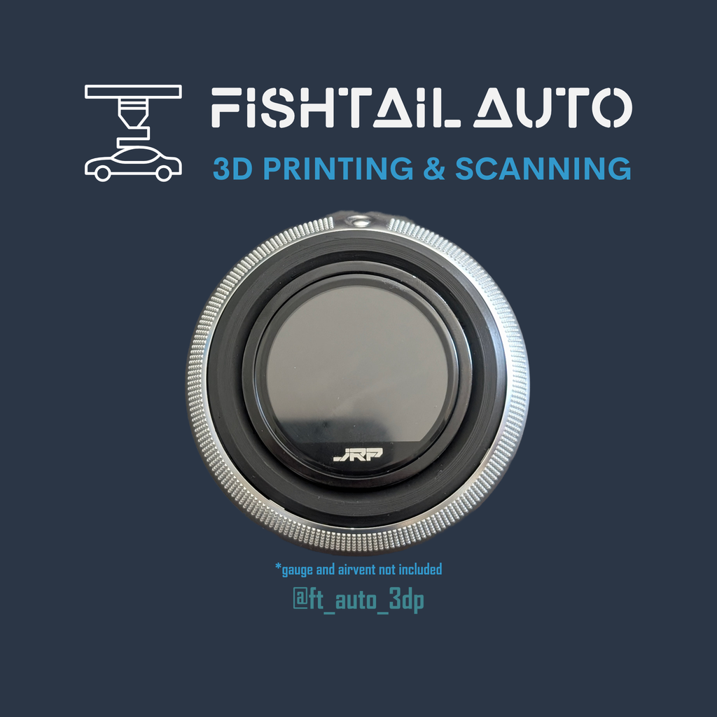 A circular automotive dial or gauge cover with a silver textured outer ring and a dark center, shown on a dark blue background with the text 'FISHTAIL AUTO 3D PRINTING & SCANNING' and a small line drawing of a car on the upper left.